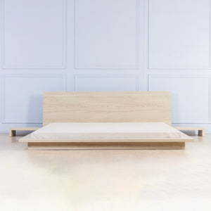 Low bed with bedside tables