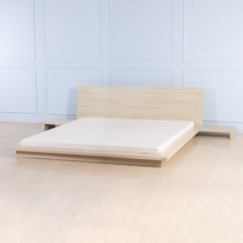 Low bed with bedside tables