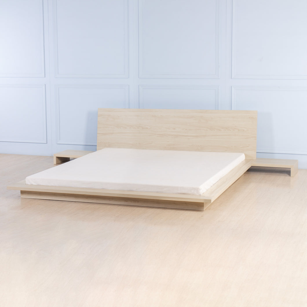 Low bed with bedside tables